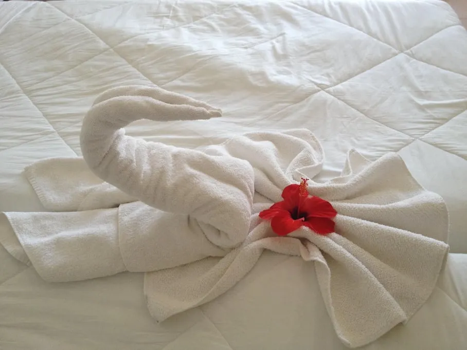 Prepared guest bed with hospitality details